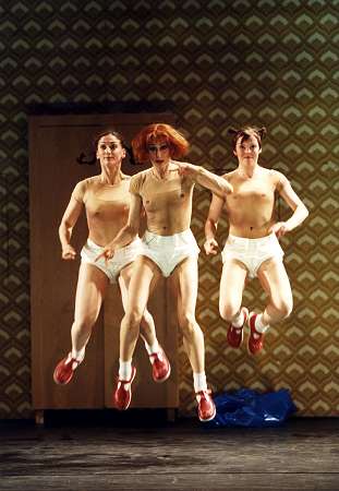 Lauriane Deltail (left), Oriola Islama (as Petrushka) and E J Boyle (right) in the Opera North 2002 production of Stravinsky's 'Petrushka'. Photo: Bill Cooper