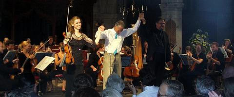 Sharing in the glory at the end of 'Romanza', Katharine Gowers, Robin Holloway and George Vass, with the Festival Orchestra. Photo: Keith Bramich