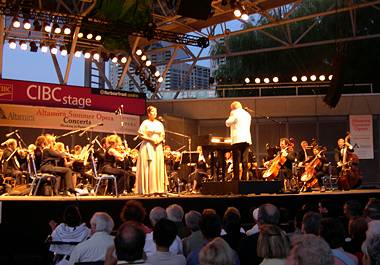 Soprano Colleen Skull and COC General Director Richard Bradshaw with the COC Orchestra at the 2003 Altamira Summer Opera Concerts. Photo © 2003 Nisha Lewis