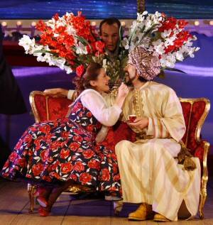 Michelle Walton (Fiorilla), Jeremy Huw Williams (The Poet, rear) and Tim Mirfin (Selim) in Buxton's 'Il Turco in Italia'