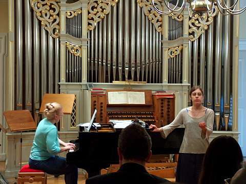 A student at the Altötting Music School performs a Lied for visiting journalists. Photo © 2005 Philip Crebbin