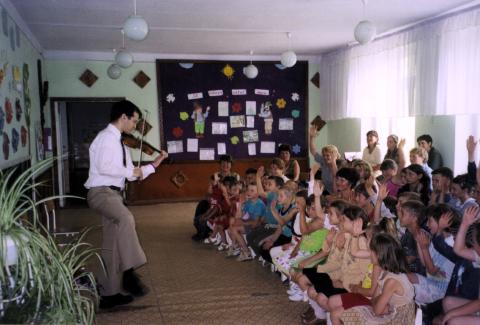 Playing a game with children in Farladani, Moldova